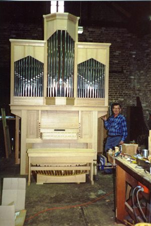 Roger Pogson with the College Organ during construction.